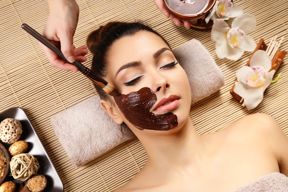 woman getting a charcoal facial